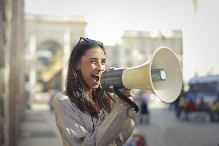 a woman using a megaphone