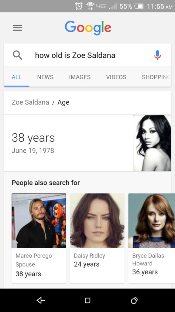A Google search on “how old is Zoe Saldana” on a smartphone screen.